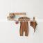 Baby spring solid color pit strip long-sleeved one-piece romper