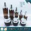 Amber coloured cosmetic glass lotion bottles with silver pump cap