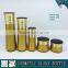 Gold yellow coloured cosmetic glass bottle and cosmetic glass cream jar