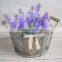 round metal flower pot stand with wooden heart button and ribbon