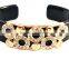 featuring gold plated detail and loop design open bangle