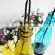 Scented candle in colored glass jar hanging bottle