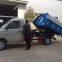 Hook arm garbage truck