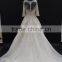 New champagne colored A-line half sleeve straight neckline wedding dress with silver thread lace