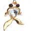 features a large crystal and two black microset crystals 18K gold earring