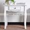 four leged small white portable wood table