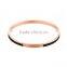 Rose gold plated with black enamel stainless steel bangle with engrave logo