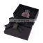 High quality clothing presents in black cardboard boxes