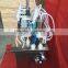  China high quality vacuum four head perfume filler,small volume perfume filler