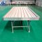Hydroponic flood tray ebb and flow bench in greenhouse rolling table