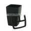 Black toothbrush holder toothbrush and toothpaste inside