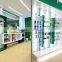 Customied wholesale price nice design MDF made pharmacy display rack