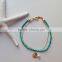 blue green seed bead bracelet with gold tube
