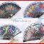 Spanish style plastic folding fan with flower