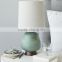 wholesale round base decorative blue poly table lamp with beige cylinder linen shade