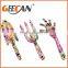 Metal mini spades and rake for kids for gardening using