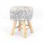 Customized beautiful snow white  faux fur round stool chair with wooden legs for living room