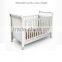 OEM Modern White Lacquer MDF Baby Cot Bed With Wheels