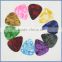 Different size guitar pick sheet material for acoustic guitar