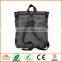 Unisex messenger bag and backpack. Grey Wool-Polyester mix with green details and lining. Multiple pockets