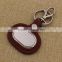 Oval brown leather keychain/blank metal car keychain with logo promotion                        
                                                                                Supplier's Choice