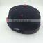 wholesale custom design your own logo 7 panel black snapback hat with woven label