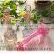 Various colored tall glass bottle vase