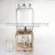 huge glass mason jar with tap with wooden stand