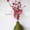 plum artificial flower in vase