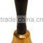 antique brass bell with wooden handle
