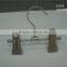 The HEAD metal hanger with transperant immesed clips(black n) and transparent injection ends.