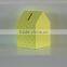 Yellow wooden piggy bank