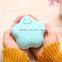 Hand holding a small hand warmer Charging treasure power bank Lovely warm baby electric cake explosion-proof