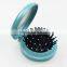 Plastic round travel hair comb with mirror
