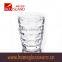 300ml clear glass cup with small bubbles at the bottom and embossed letter for drinking
