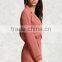 Lady Woven surplice neckline notched lapels an elasticized waist long sleeves a center-back pleat and contrast piping romper