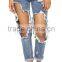 Destroyed jeans with shredded holes throughout. (LOTW003)