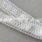 100% polyester kintted lace trim with white color leather ribbon trimmings for garment