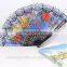 Spanish style plastic folding fan with flower
