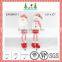 Red and white christmas long legs sitting