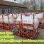 Agricultural tractor boom sprayer with plastic hopper