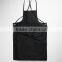 Black canvas work apron with crossback straps