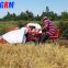 Cheapest price and good quality mini paddy rice combine harvester / rice reaper working in wet field