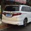 The Honda Odyssey car is surrounded by a 14-15 odyssey front and rear spoiler skirt, and the odyssey bumper chin lip