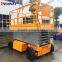 Moving scissor lift platform with battery for outdoor