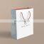 OEM Supplier Custom Printed Boutique Garment Carrier Packaging Bag  Foldable Reusable Luxury Paper Shopping Bag With Logo Handle