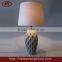 flowing ceramic base and fabric shade table lamp