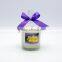 glass candle jar with color ribbon