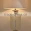 Moroccan brass table lamp with pierced lampstand and beige drum fabric shade for villa decoration