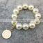 Large Pearls Stretch Bracelet With Monogrammed Enamel Charm